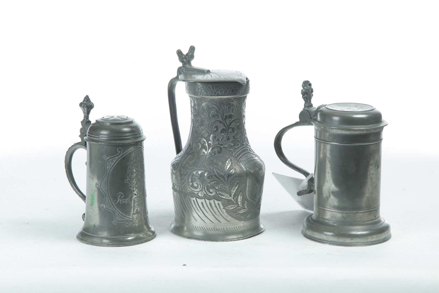 Appraisal: TWO CONTINENTAL PEWTER STEINS AND A FLAGON Late th- th