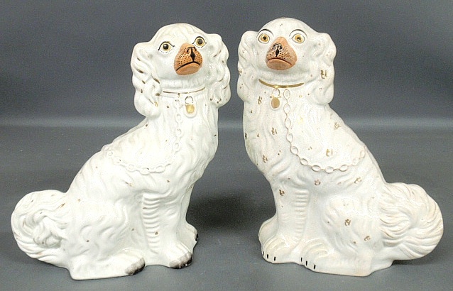 Appraisal: - Two similar Staffordshire seated spaniels c Approx h x