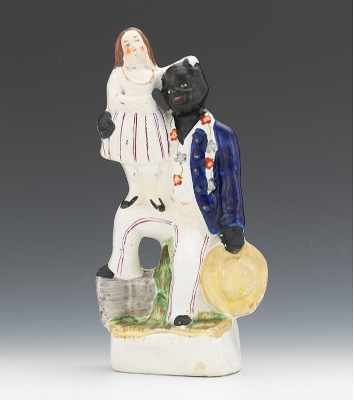 Appraisal: A Figural of Uncle Tom Eva With seated Uncle Tom