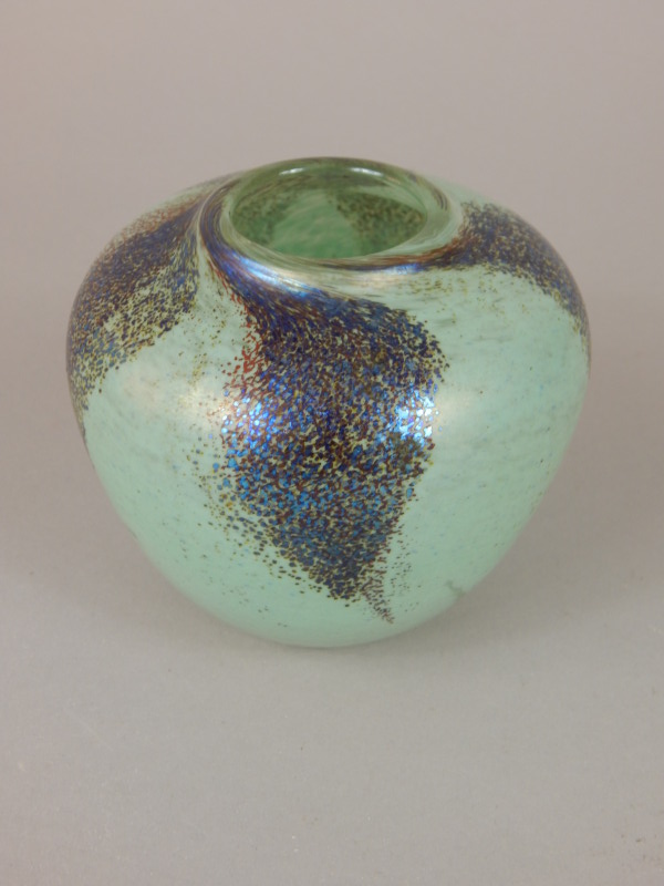 Appraisal: An iridescent Art Glass vase decorated in opaque white metallic