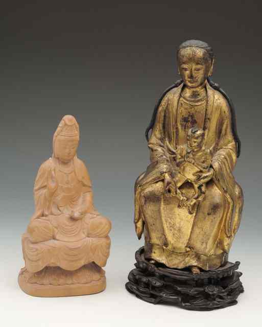 Appraisal: A CHINESE GILT METAL BODHISATTVA on a carved hardwood stand