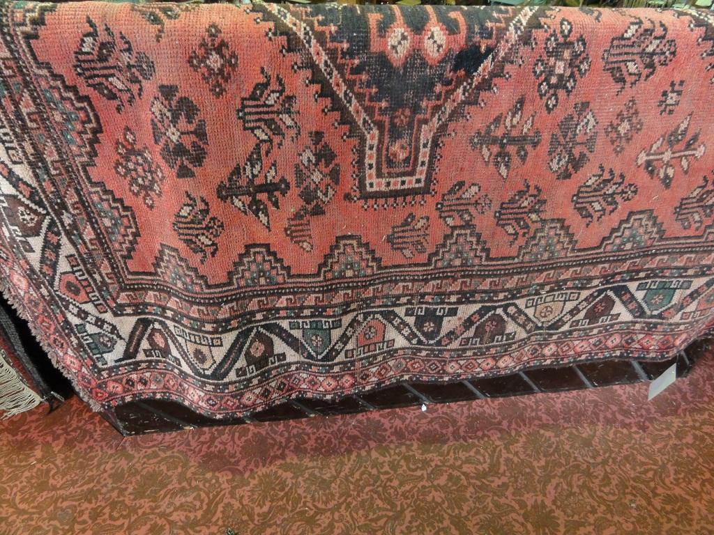 Appraisal: A large Middle Eastern carpet with one row of interlocking