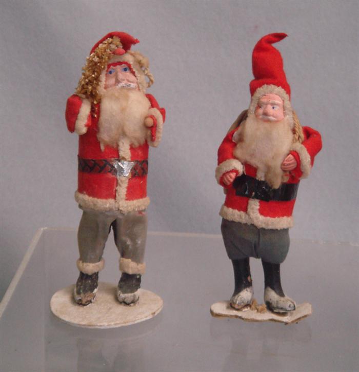 Appraisal: paper mache Santa figurines red felt jackets and hats one