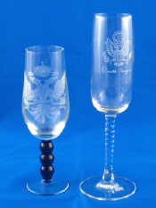 Appraisal: Two wheel engraved wine glasses one with twisted stem having