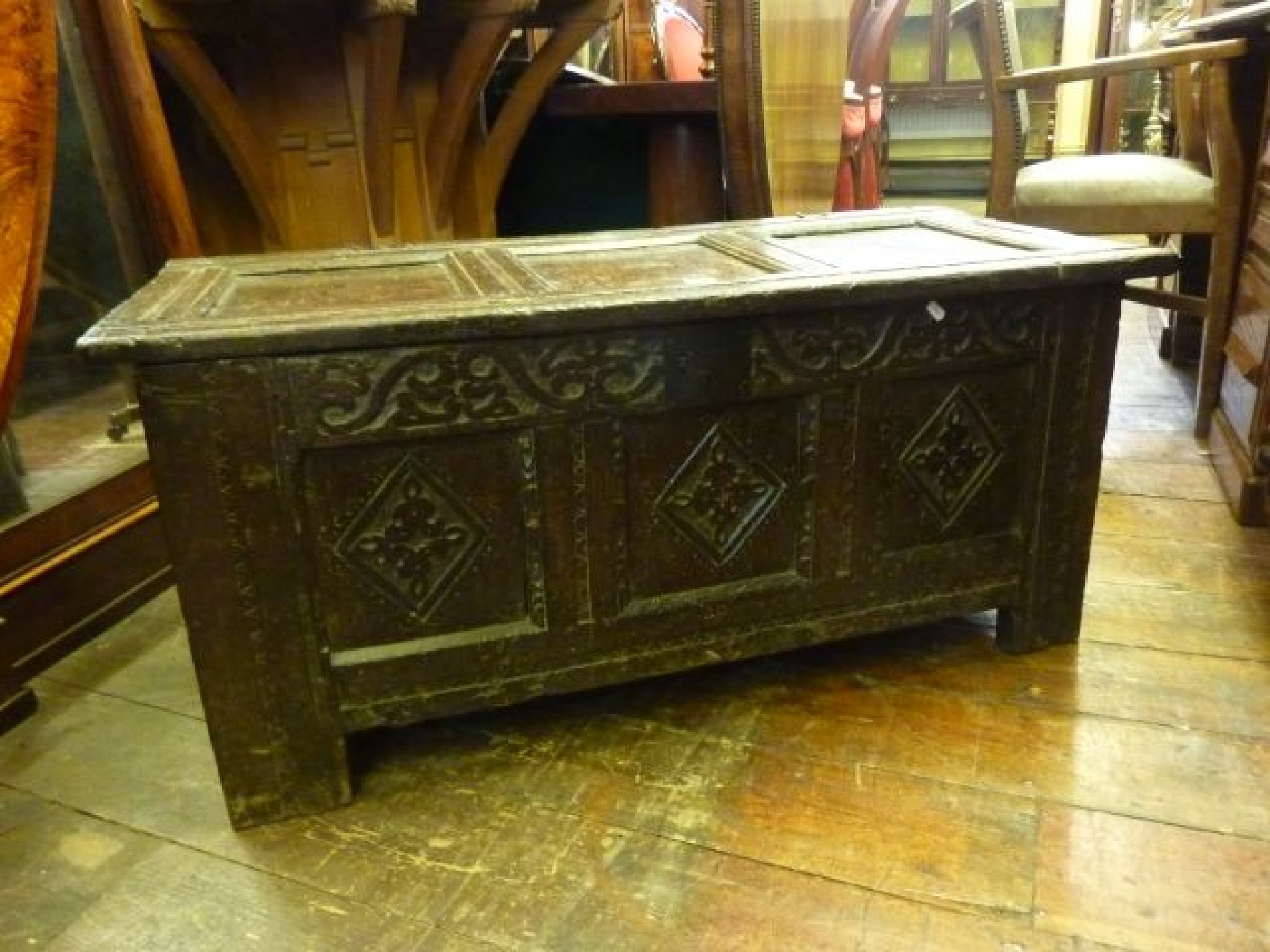 Appraisal: Early th century oak coffer with panelled frame and carved