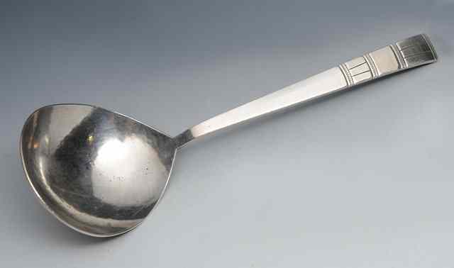 Appraisal: Bernard Cuzner British - An Arts Crafts silver serving spoon