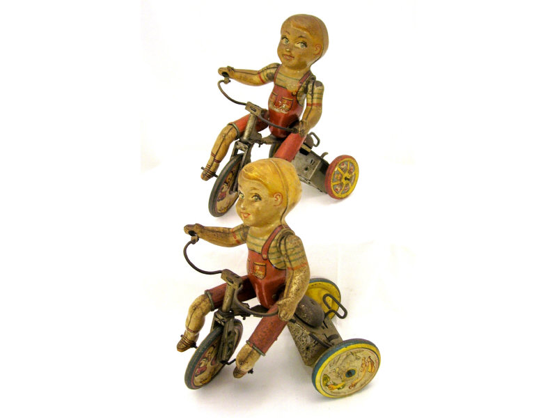 Appraisal: Keywind Kiddie Cyclists Two Unique Art Manufacturing Co Kiddie Cyclists