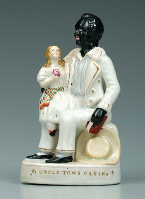 Appraisal: Staffordshire figure of Uncle Tom seated figure with child on