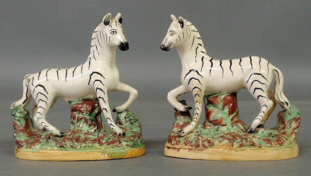 Appraisal: Fine pair of Staffordshire zebras c h x w x