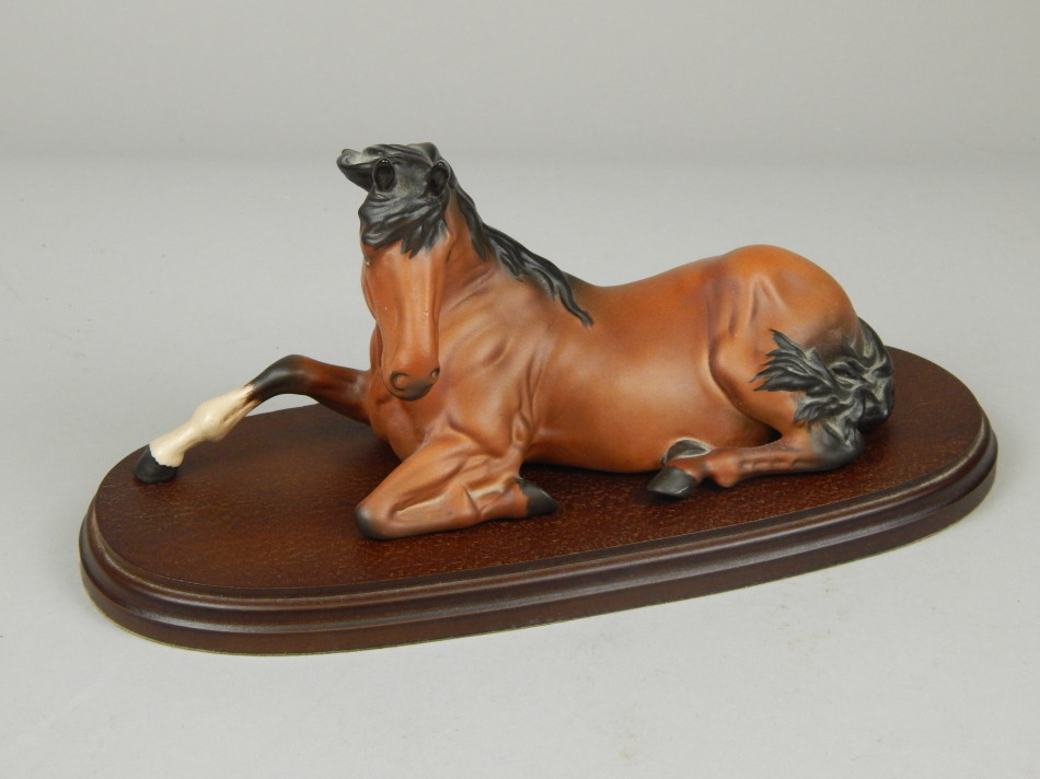 Appraisal: A Beswick figure of a seated horse in a brown