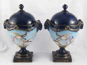 Appraisal: A pair of th century urns and covers with cobalt