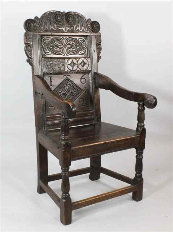 Appraisal: A Charles I oak panel back armchair probably South West