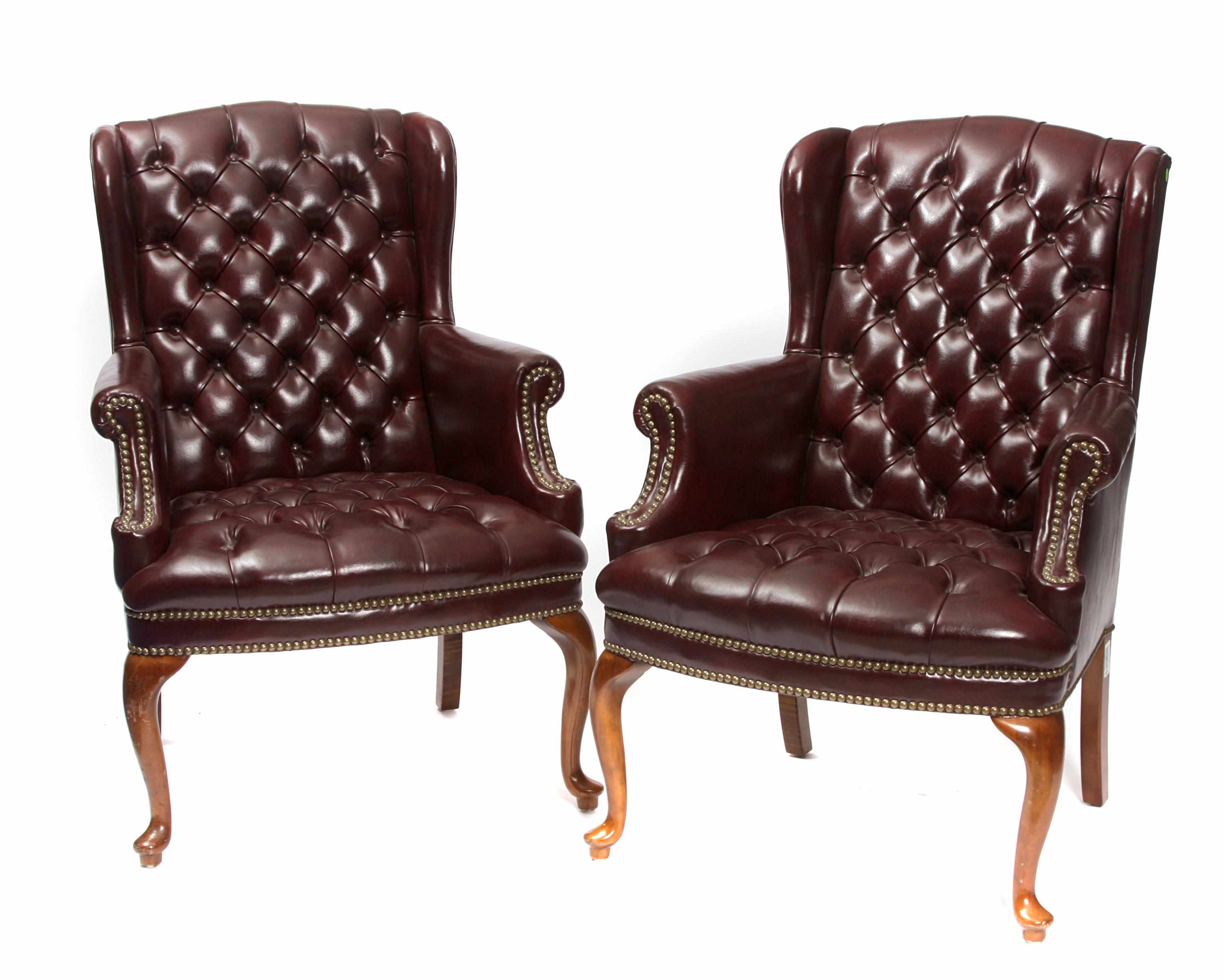 Appraisal: A pair of George III style wing armchairs height in