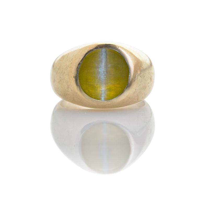 Appraisal: CAT'S EYE CHRYSOBERYL GOLD RING Nearly spherical cabochon cut cat's