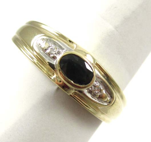 Appraisal: SAPPHIRE DIAMOND AND FOURTEEN KARAT GOLD RING featuring an oval-cut