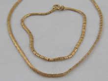 Appraisal: A yellow metal tests carat gold flat link necklace and