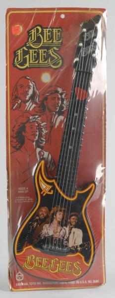 Appraisal: Vintage Carnival Toys Bee Gees Guitar Toy Description American Marked