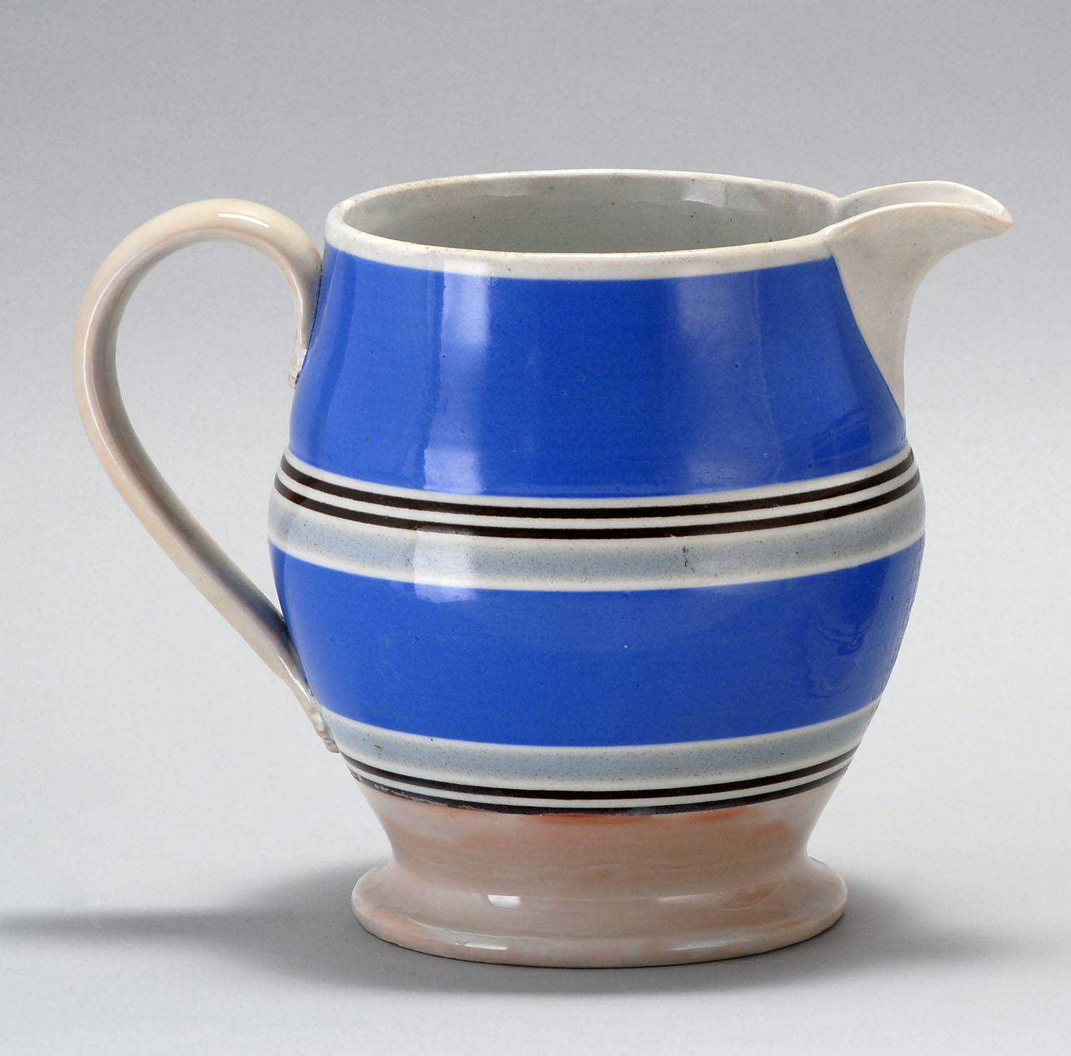 Appraisal: TH CENTURY ENGLISH MOCHAWARE HANDLED PITCHER decorated with two wide