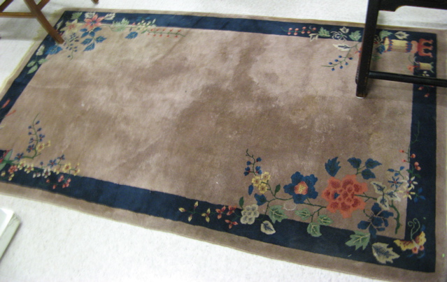 Appraisal: CHINESE NICHOLS AREA RUG having a plain field with colorful