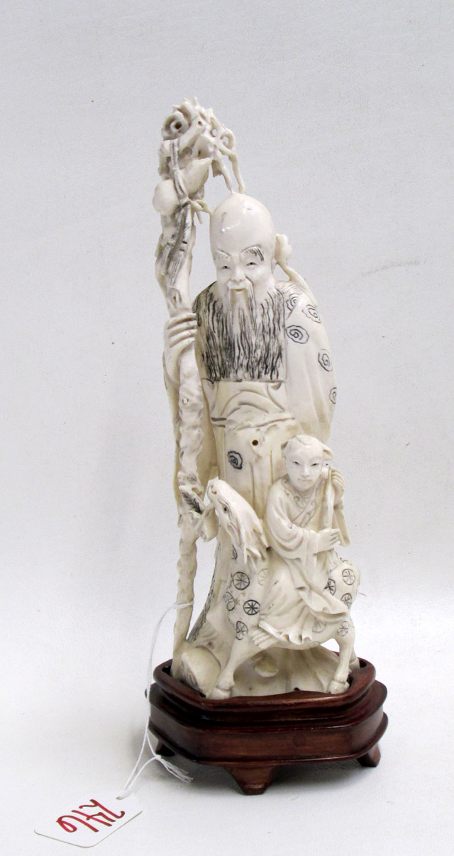 Appraisal: CHINESE CARVED IVORY FIGURAL depicting a man holding a branch