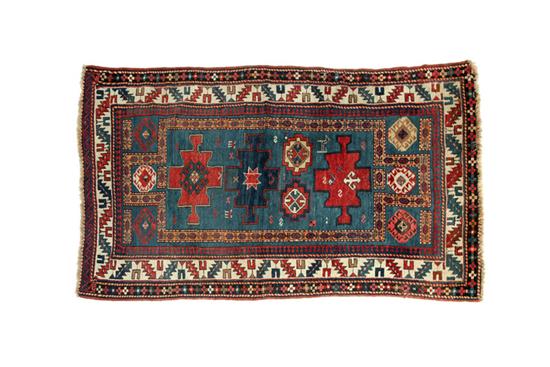 Appraisal: ORIENTAL RUG Kazak Double prayer pattern with ivory border and