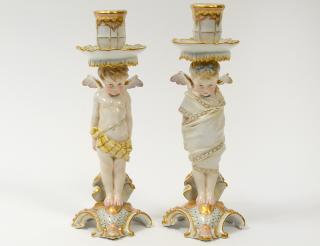 Appraisal: PAIR OF ROYAL BERLIN PORCELAIN FIGURAL CANDLESTICKS German Late th