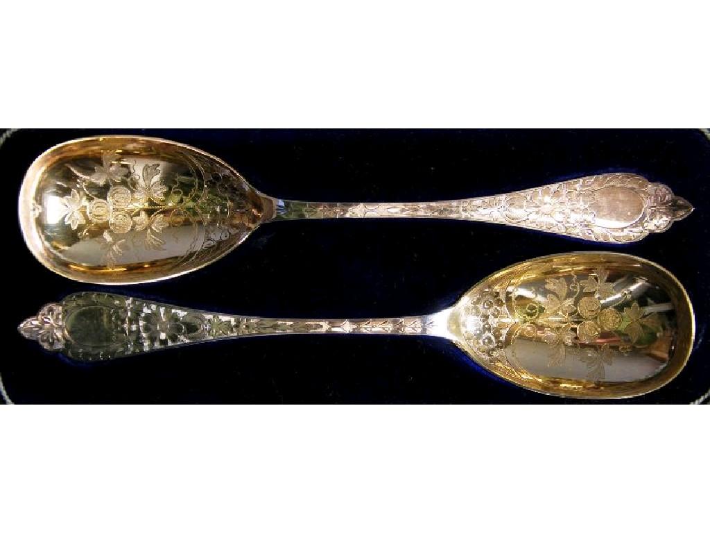 Appraisal: PAIR OF ELECTROPLATE SERVING SPOONS in case with parcel gilt