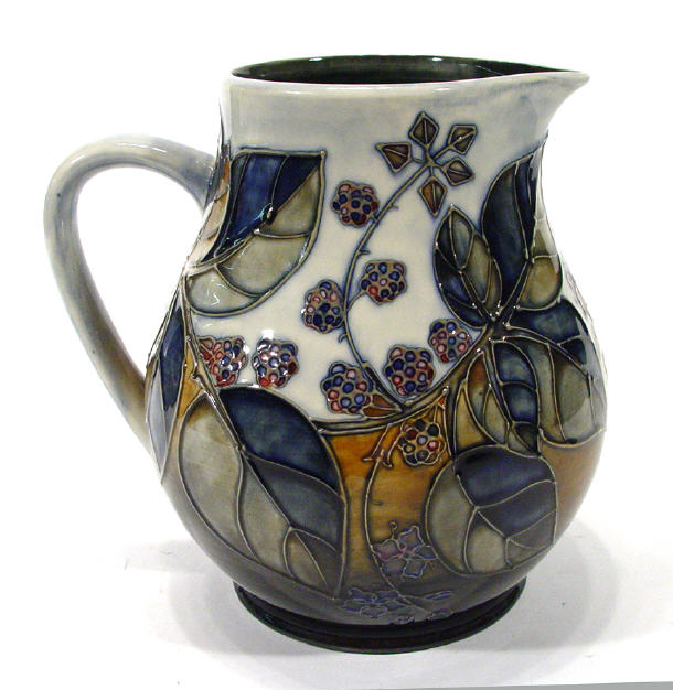 Appraisal: Large Moorcroft pottery jug hand painted and tubelined with Bramble