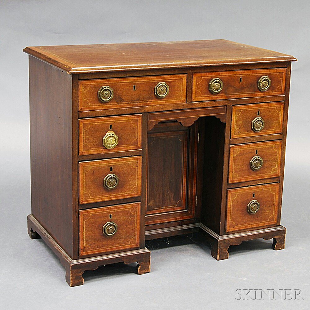 Appraisal: George III-style Mahogany Veneer Kneehole Desk the thumbmolded top with