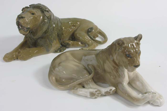 Appraisal: PAIR ROYAL COPENHAGEN LIONS the male designed by Lauritz Jensen