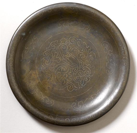 Appraisal: A SMALL BRONZE SHISOU PLATE WITH SILVER INLAID ORNAMENT China