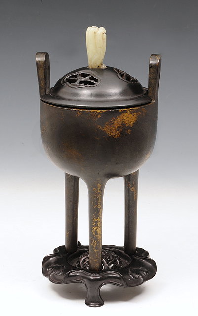 Appraisal: A CHINESE BRONZE TALL CENSER with hardwood pierced cover having