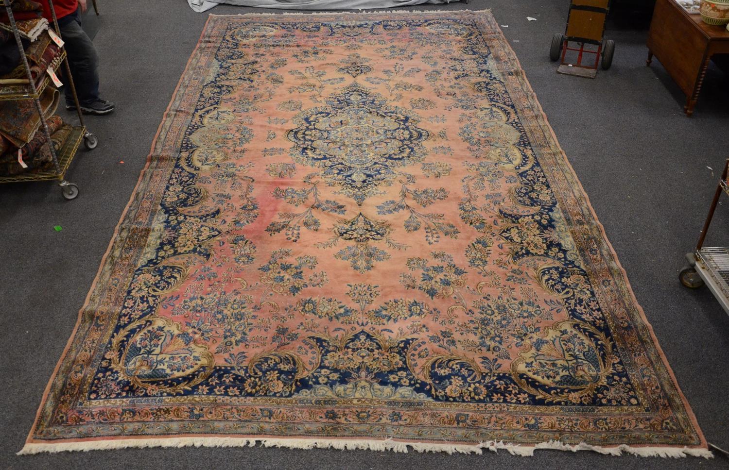 Appraisal: x Kirman rug scattered areas of wear and fading