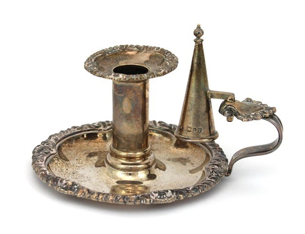 Appraisal: A Victorian silver chamber candlestick of circular form decorated with