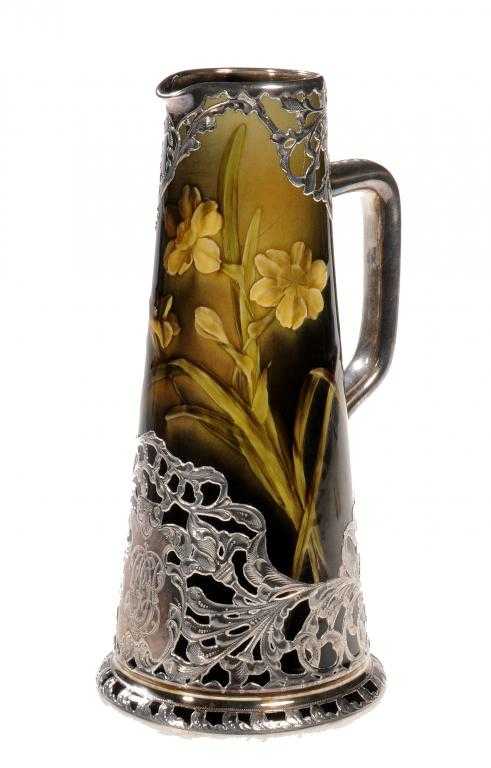 Appraisal: A ROOKWOOD ART POTTERY SILVER OVERLAID JUG painted in coloured