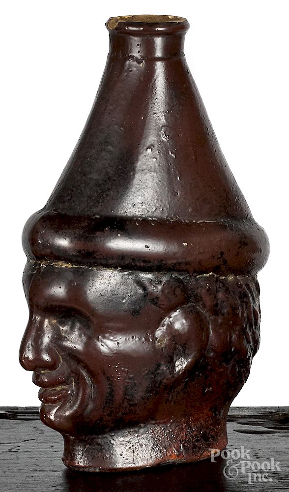 Appraisal: Unusual pottery man's head flask Unusual pottery man's head flask