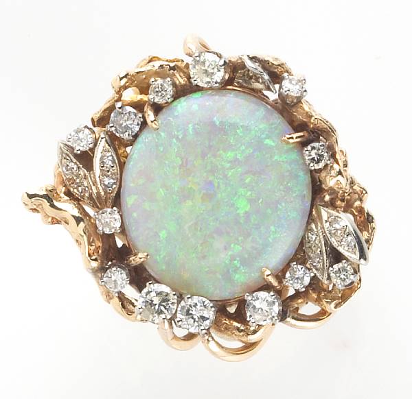 Appraisal: An opal diamond and k gold ring minor chips and