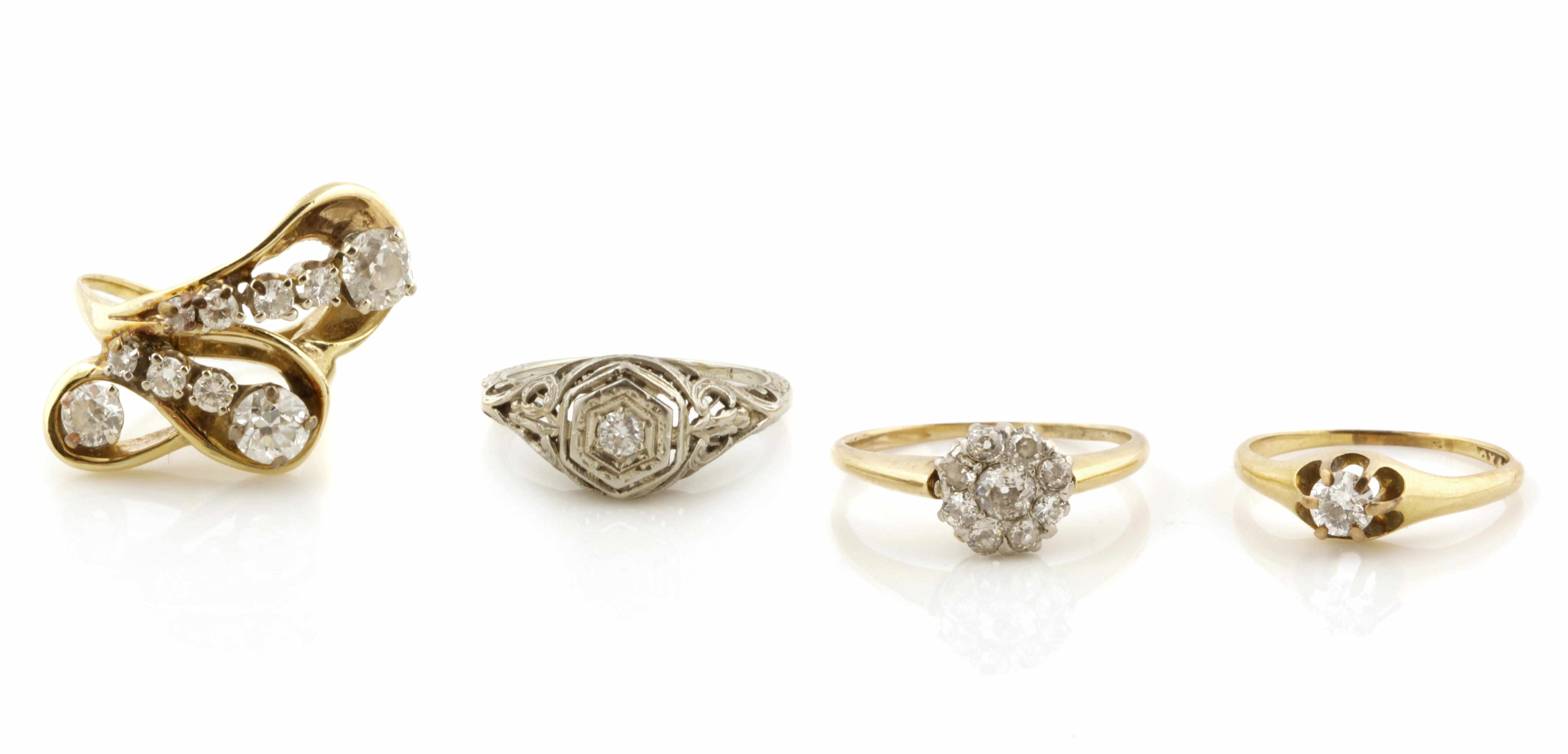 Appraisal: A collection of four diamond and bicolor gold rings estimated