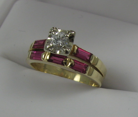 Appraisal: DIAMOND RUBY AND FOURTEEN KARAT GOLD RING centering a round-cut