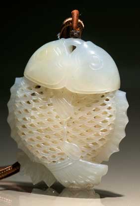 Appraisal: CHINESE WHITE JADE PENDANT Well carved Chinese reticulated two-part white