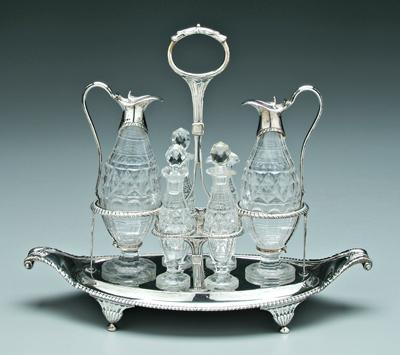 Appraisal: George III English cruet set frame with oval base scroll