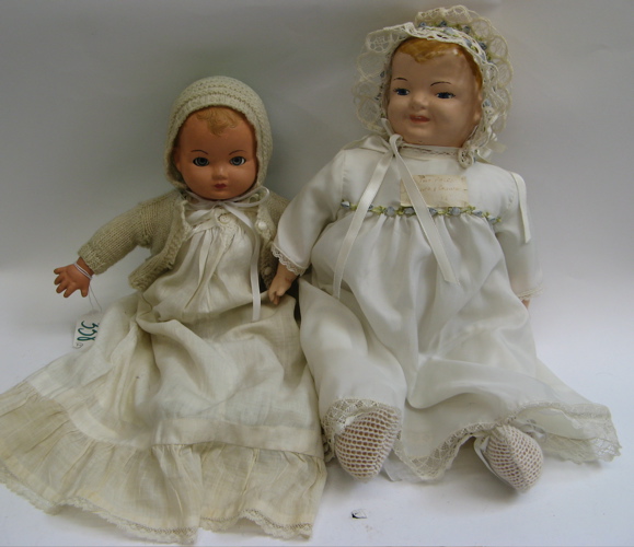 Appraisal: COMPOSITION DOUBLE FACED DOLL AND BABY DOLL the two-faced doll