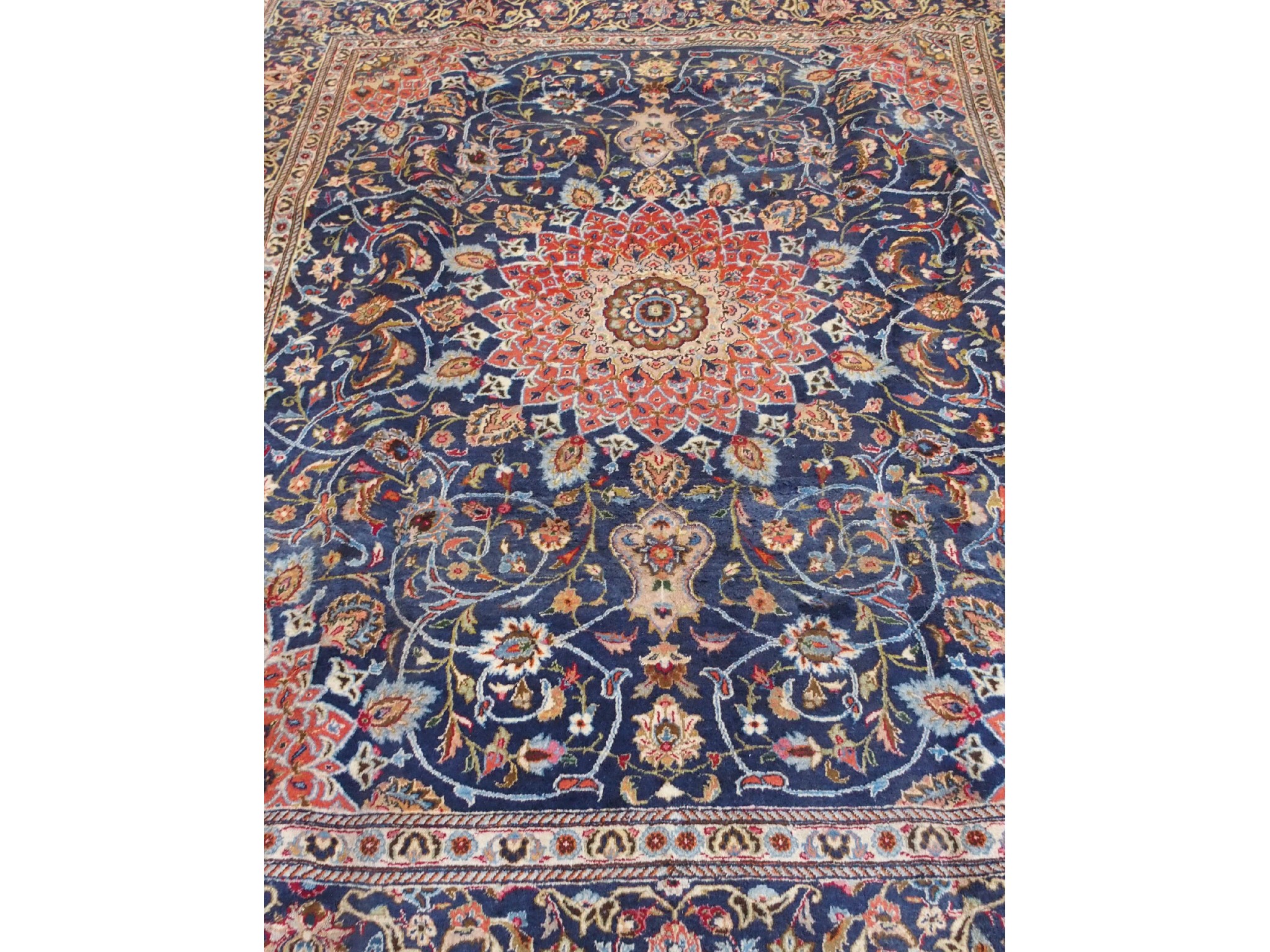 Appraisal: A large Meshed rugwith foliate decoration on blue ground m