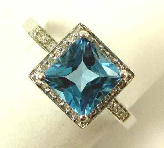 Appraisal: BLUE TOPAZ AND DIAMOND RING k white gold featuring a