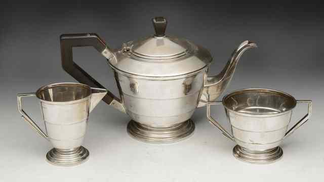 Appraisal: AN ART DECO STYLE SILVER THREE PIECE TEASET of stepped