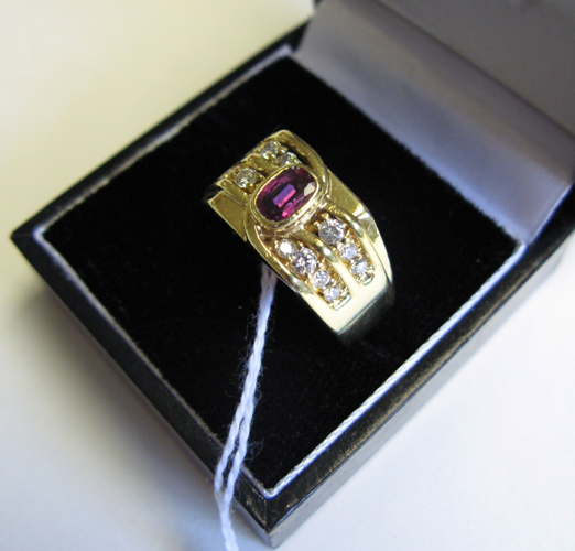 Appraisal: MAN'S GARNET DIAMOND AND FOURTEEN KARAT GOLD RING centering an