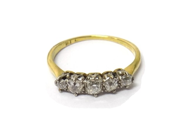 Appraisal: A gold and diamond set five stone ring claw set