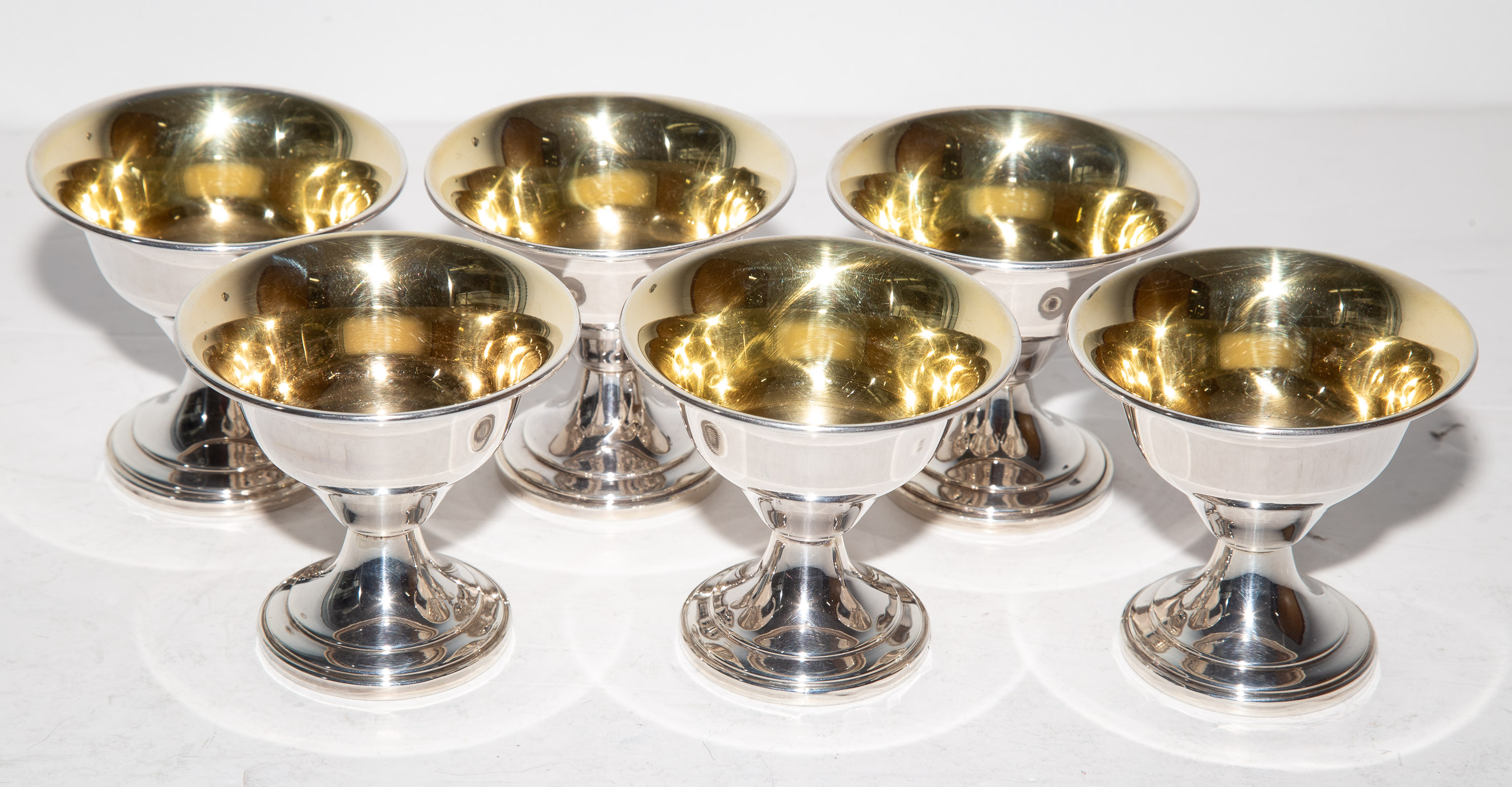 Appraisal: SIX STERLING WEIGHTED PEDESTAL BOWLS with gilt interior without monogram