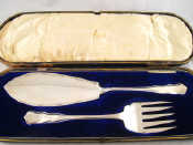 Appraisal: A cased pair of silver fish servers by Robert Stewart