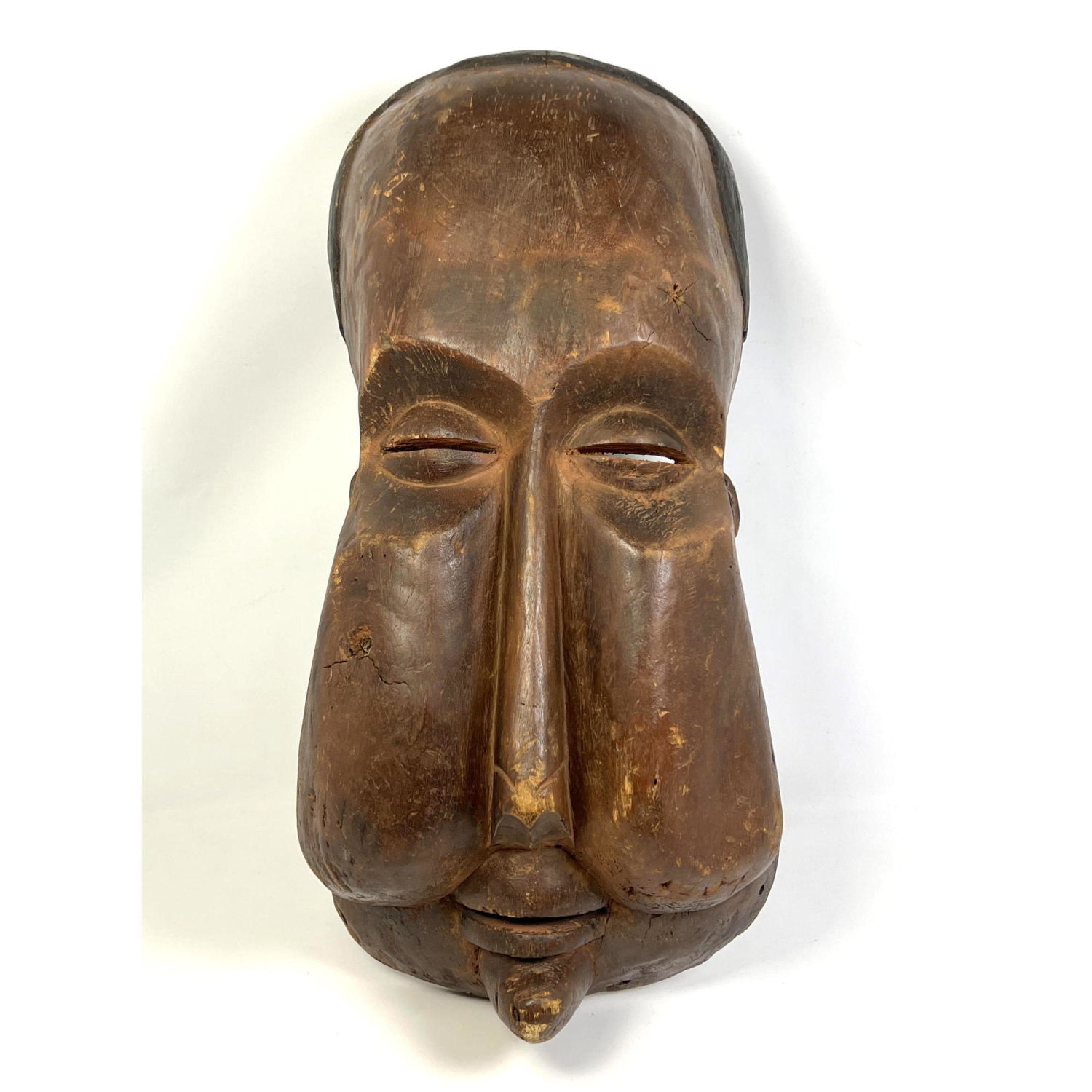 Appraisal: Vintage Carved Wood Mask Elongated face Slits for eyes and